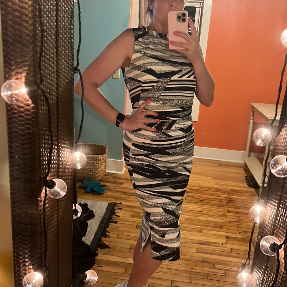 This is not a dress but a crop top and a long pencil skirt together.